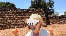 Person with a VR headset in an archaeological site.